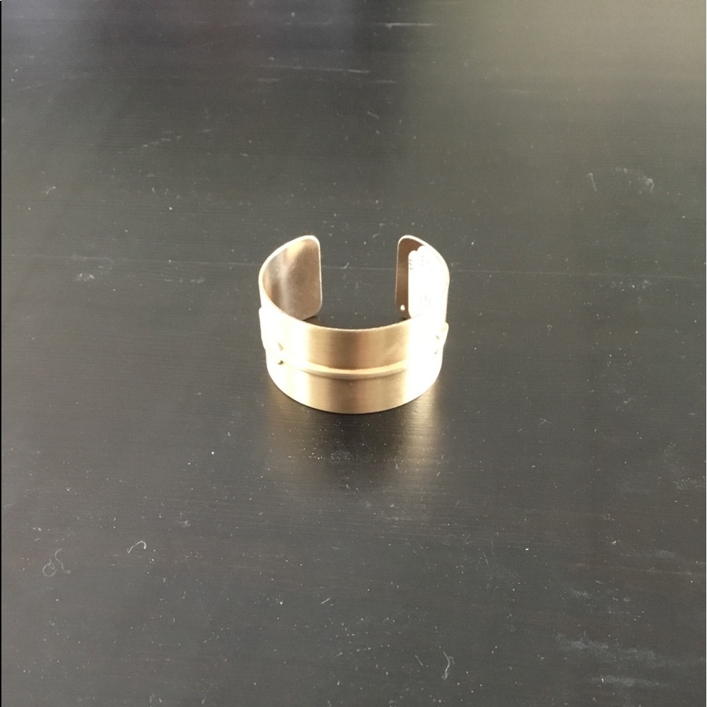 Brushed gold cuff with arrow detail